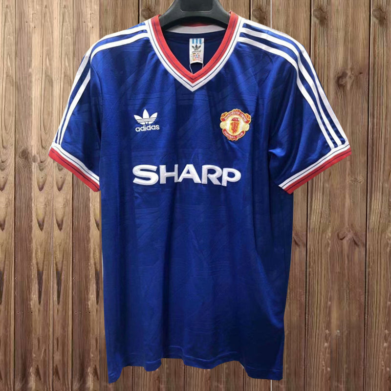 Camiseta de visitante MUFC 86-88